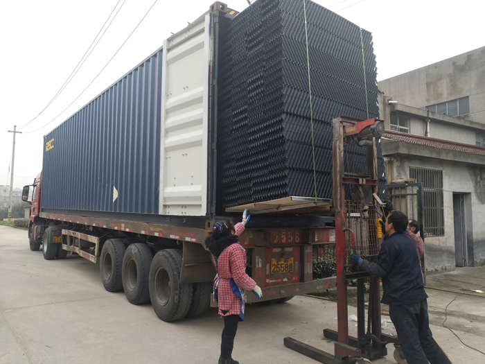 oblique cross pp pvc cooling tower fills are loaded by our workers